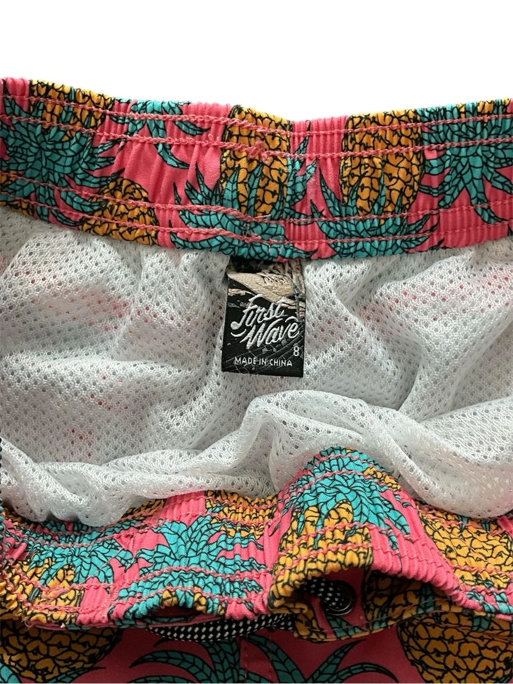 First Wave Pink Pineapple Swim Trunks with Teal Pineapple Leaves